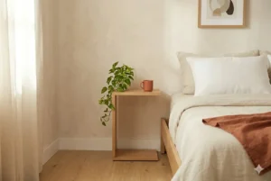 C-shaped slide-under nightstand small bedroom – space-saving design beside platform bed