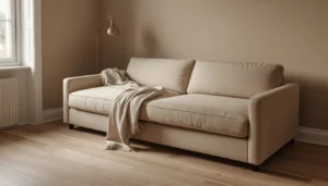 Sleeper sofa conversion mechanism in small apartment — fold-flat boneless sofa open to sleeping position