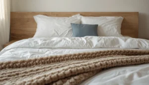 cozy small bedroom ideas layered linen bedding with knit throw and euro pillows in oatmeal tones